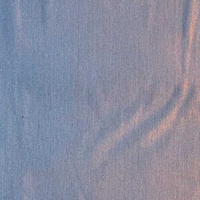 Coated denim med folie print i lyseblå/orange