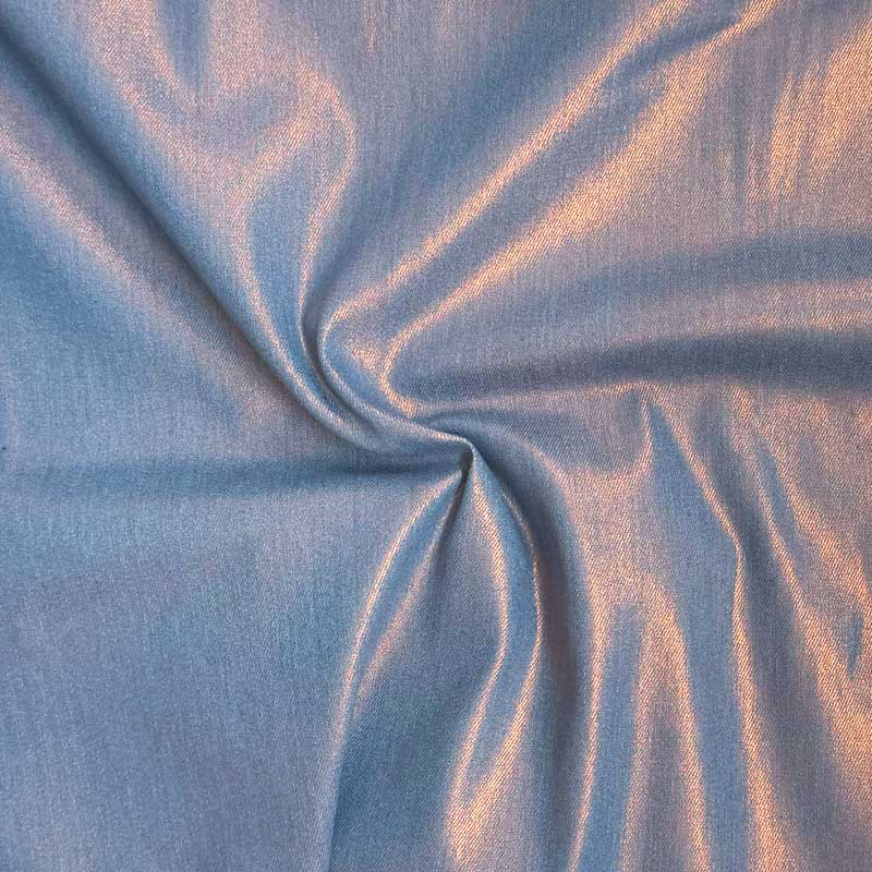 Coated denim med folie print i lyseblå/orange
