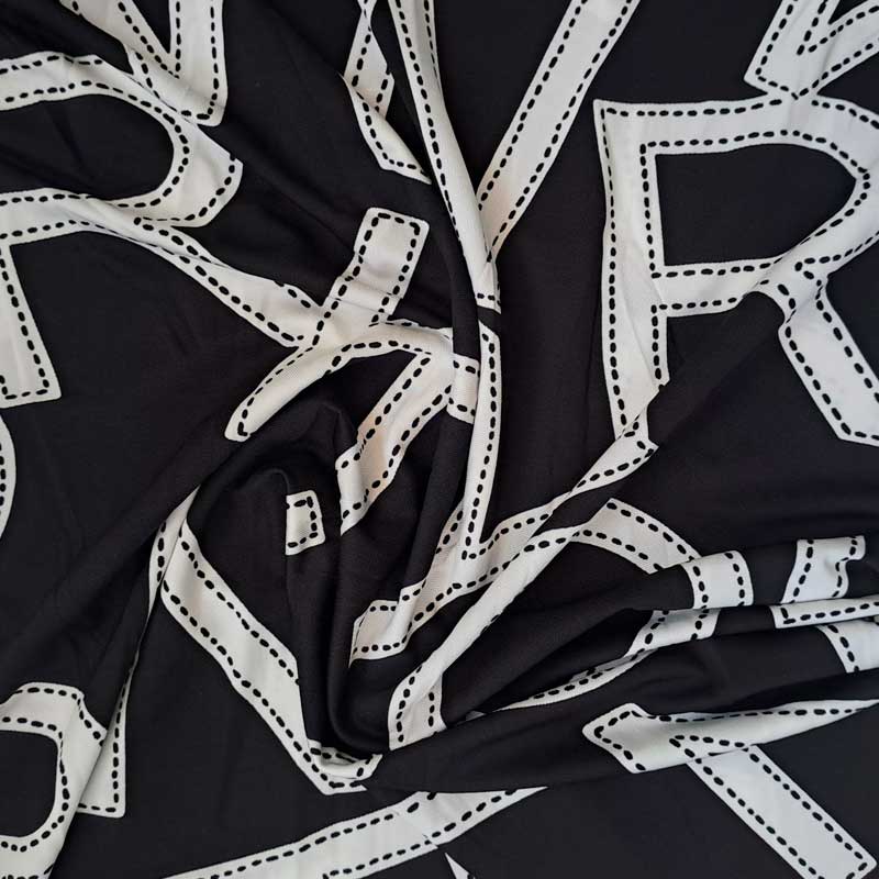 Digital viscose jersey med store bogstaver - KreStoffer