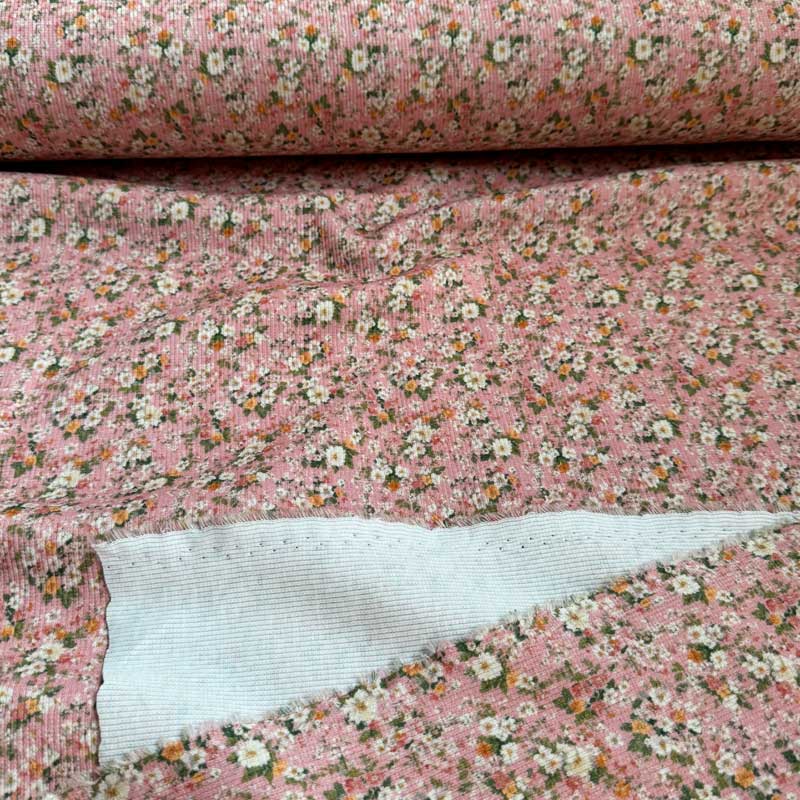 Drop needle rib jersey med små blomster på lyserød bund