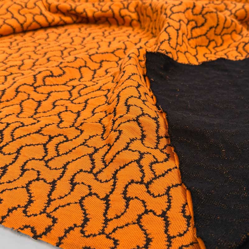 Jacquard strik med flettemønster, orange - KreStoffer