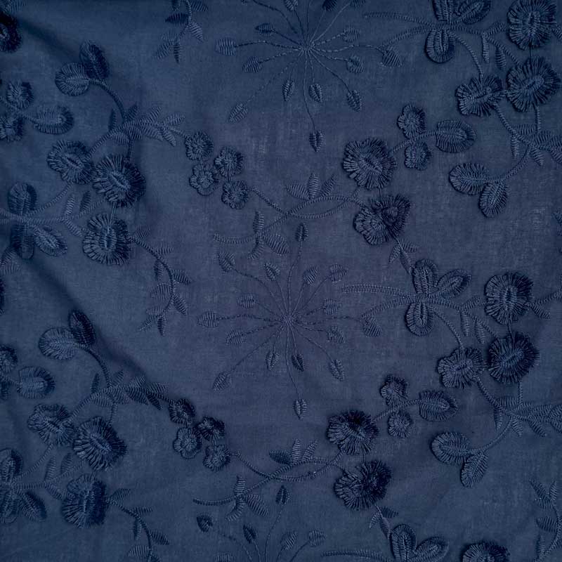Fast bomuld med løsvævet broderi i marineblå