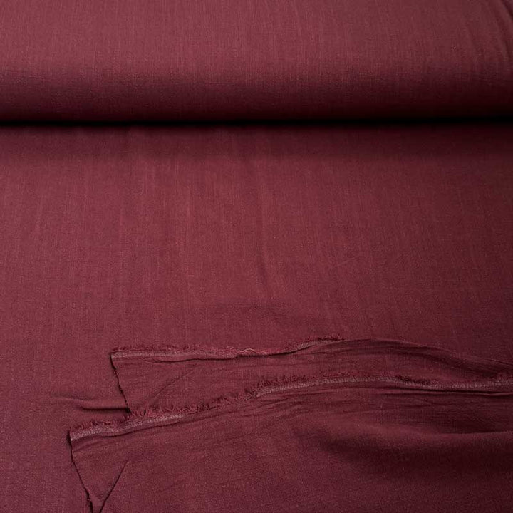 Ensfarvet fast viscose / hør i støvet bordeaux