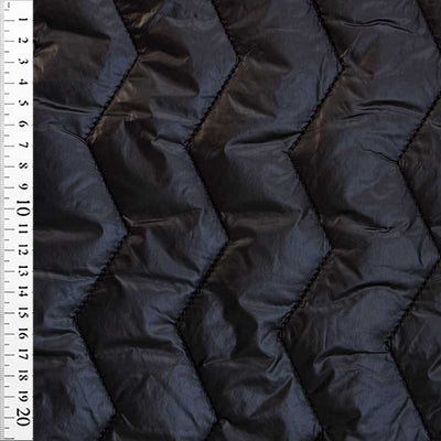 Quilt i zig-zag baner i sort