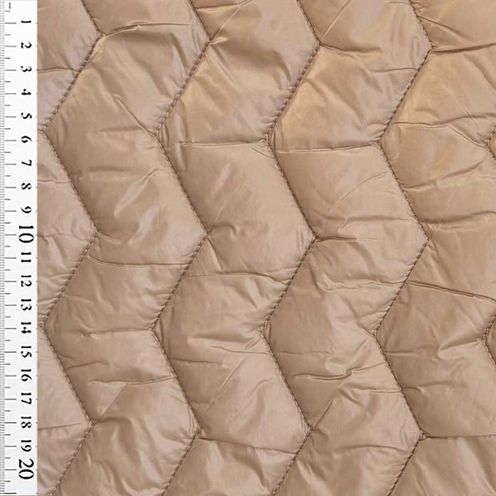 Quilt i zig-zag baner i beige
