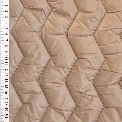 Quilt i zig-zag baner i beige