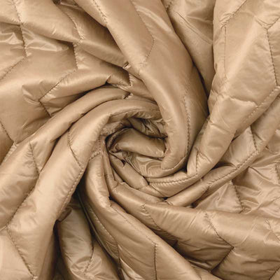 Quilt i zig-zag baner i beige