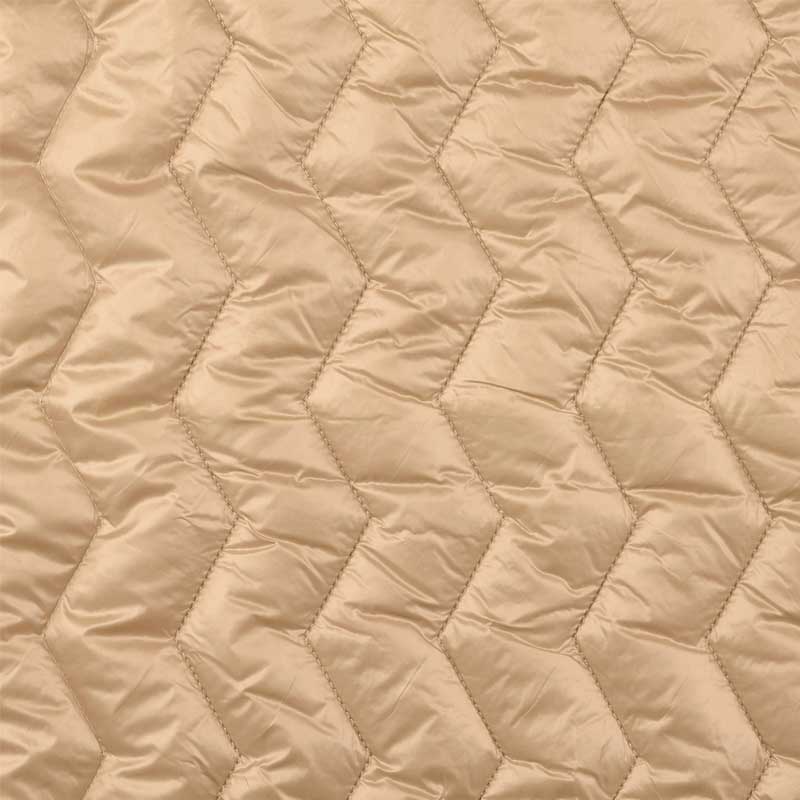 Quilt i zig-zag baner i beige