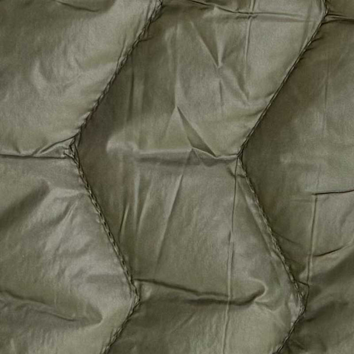 Quilt i zig-zag baner i olivengrøn