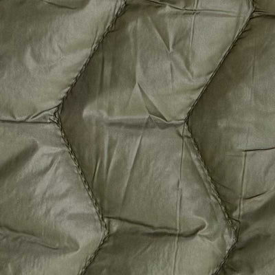 Quilt i zig-zag baner i olivengrøn