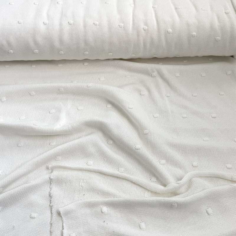 Strikstof med dutter i off-white