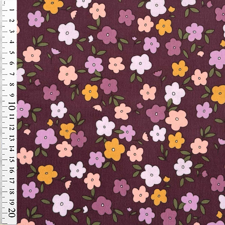 Babyfløjl med grafisk farvede blomster og blade