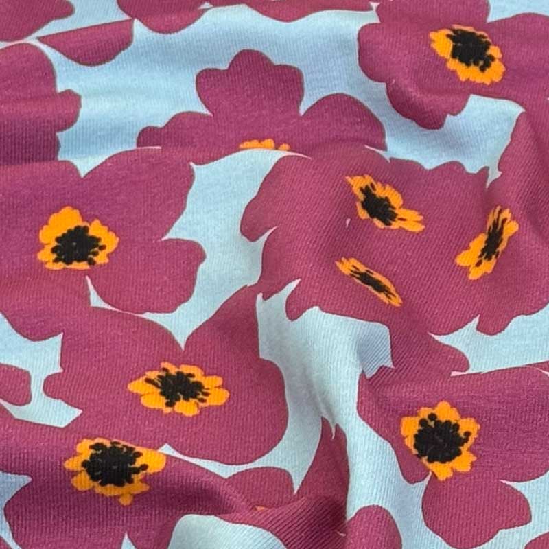 Bomuldsjersey med hindbær rød smørblomster