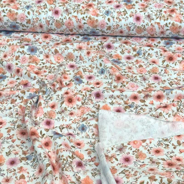 Bomuldsjersey med lyse romantiske blomster