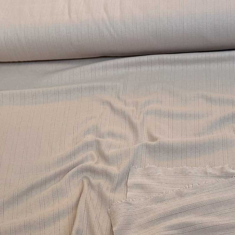 Ensfarvet beige bomuldsjersey med hulmønster