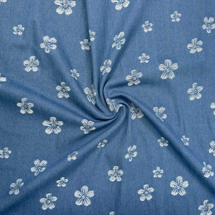 Denim med vævede blomster på jeansblå bund