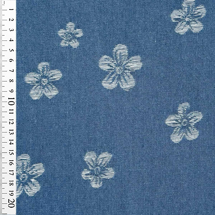 Denim med vævede blomster på jeansblå bund