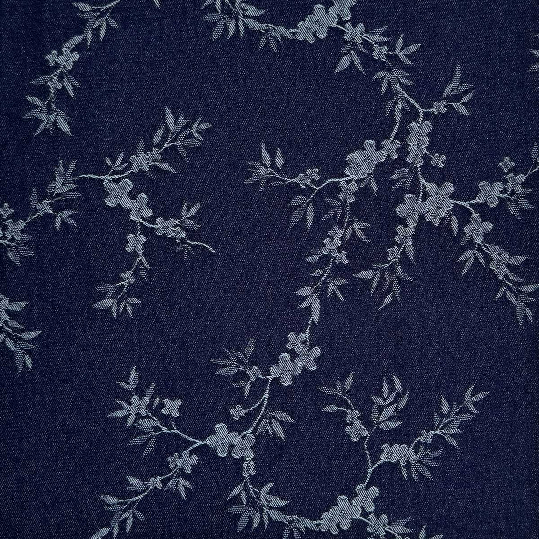 Denim med vævede blomsterranker i marineblå
