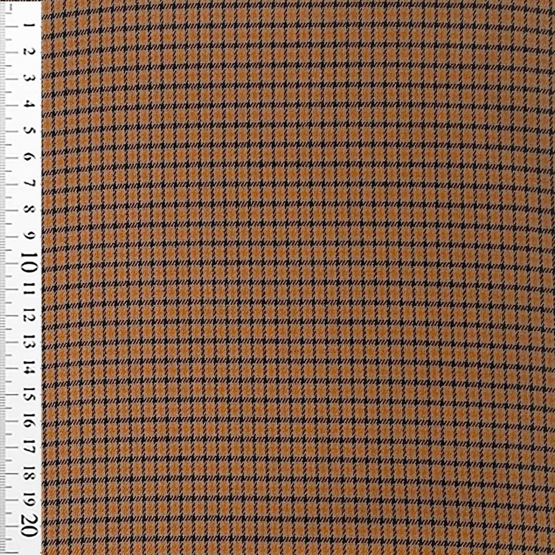 Fastvævet vare med tern orange/sort